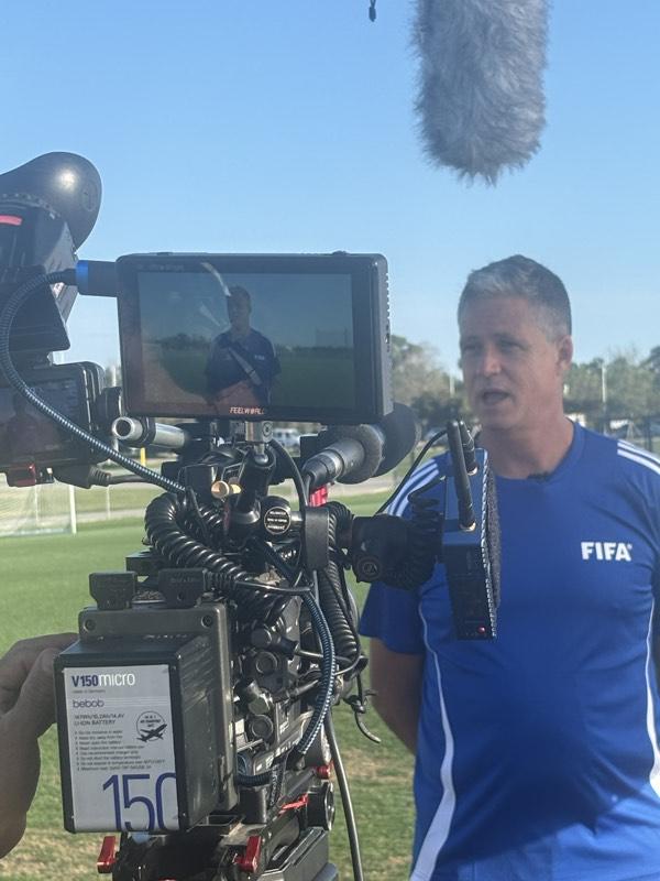 Camera operator monitoring a shot during a live interview