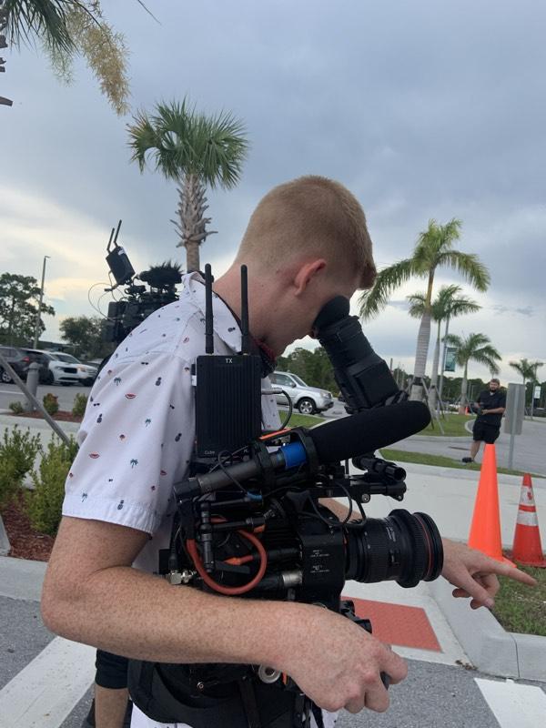 Filming an interview segment at a sports facility