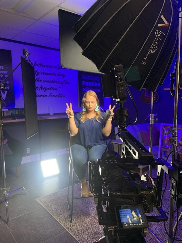 Content creator posing for camera during a shoot